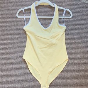 Yellow halter body suit